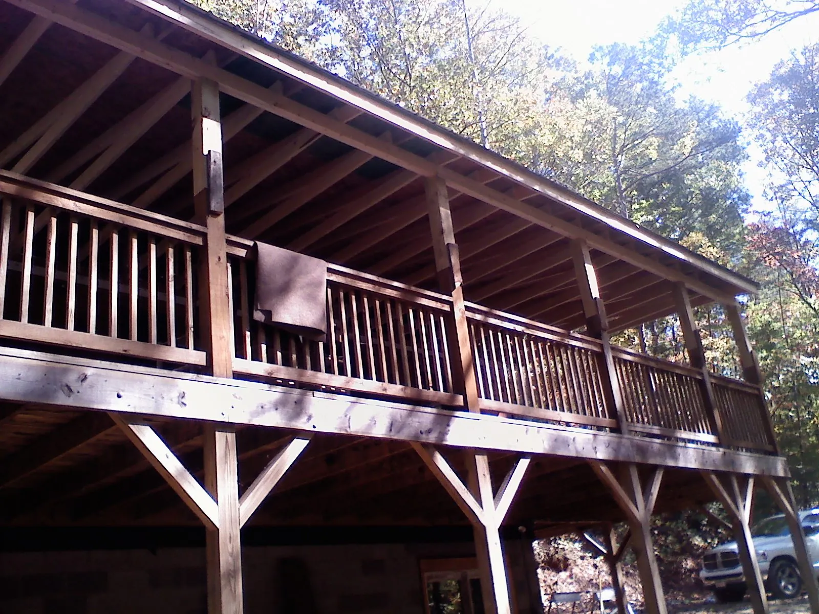 Timber framing under a new elevated porch and deck in Cascade